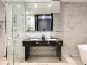 a bathroom with two sinks and a glass shower at The Platinum 2 Kuala Lumpur by LUMA in Kuala Lumpur