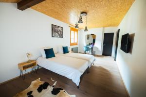 Postel nebo postele na pokoji v ubytování B&B La Forge de Diogne