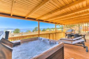 a hot tub on the deck of a house at MOBILE HOMES SELCE - ALPE JADRAN MOBIL 641 in Selce