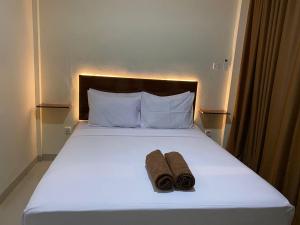 Кровать или кровати в номере NaJa Homestay
