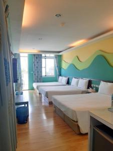 Voodi või voodid majutusasutuse 墾丁大街 皇佳旅店 toas