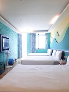 Voodi või voodid majutusasutuse 墾丁大街 皇佳旅店 toas