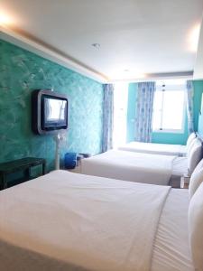 Voodi või voodid majutusasutuse 墾丁大街 皇佳旅店 toas
