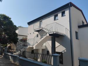 a staircase on the side of a building at Apartmani Ante & Ivano Biograd in Biograd na Moru