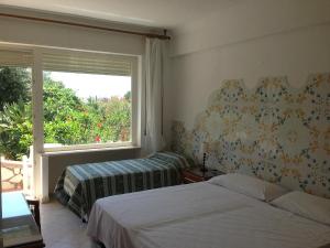 Postel nebo postele na pokoji v ubytování Hotel 4 Stagioni