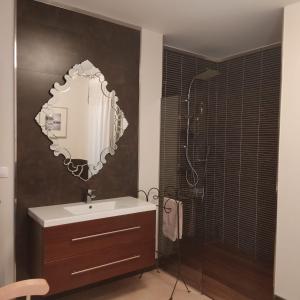 a bathroom with a sink and a mirror on the wall at Casa De Campo Clara in Santa Cristina