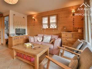 a living room with a couch and a table at Appartement Le Grand-Bornand, 3 pièces, 4 personnes - FR-1-391-5 in Le Grand-Bornand