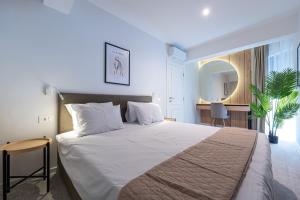 Un pat sau paturi într-o cameră la Bonita Residence