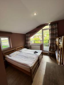 Rúm í herbergi á Guest House 15