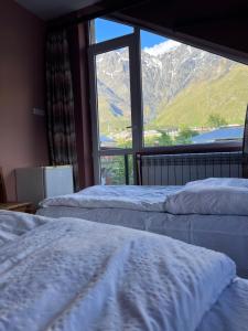 Rúm í herbergi á Guest House 15