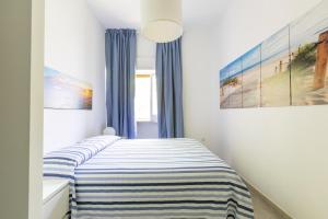 Ένα ή περισσότερα κρεβάτια σε δωμάτιο στο Villa Cirenaica by BarbarHouse