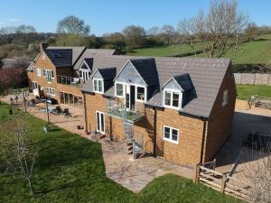 an aerial view of a house with solar panels on it at Field View in Braunston