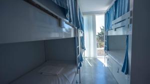 a room with bunk beds and a window at Sole'n Blu in Kaş