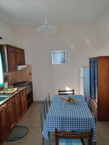 a kitchen with a table with a plate of food on it at Villa Lena in Kastraki Naxou