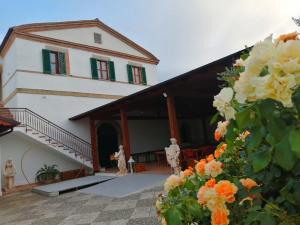 a building with two people standing outside of it at IL CASALE B&B in Cupello