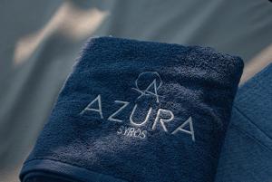 a close up of a blue towel with the word arizona at Azura View Foinikas in Finikas +9 photos