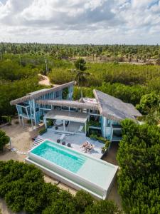 an aerial view of a house with a swimming pool at Beach Houses Moitas in Amontada