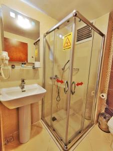 a bathroom with a shower and a sink at Orient Mintur Hotel in Istanbul