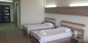Voodi või voodid majutusasutuse Cross Resort Hotel toas