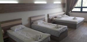 Voodi või voodid majutusasutuse Cross Resort Hotel toas