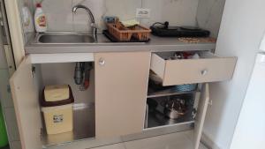 a kitchen with a sink and a counter top at Vila Juna in Ksamil