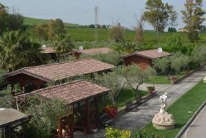 a garden with a pavilion and a statue of a lion at IL CASALE B&B in Cupello