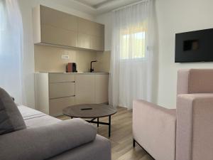 Η κουζίνα ή μικρή κουζίνα στο Madamik apartments