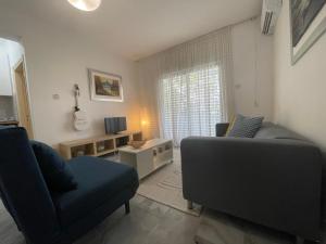 a living room with two chairs and a couch at Nicosia centre cozy appartment in Nicosia