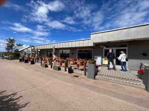 a couple of people standing outside of a building at Havsbadens B&B in Ängelholm