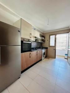 Cuisine ou kitchenette dans l'établissement Vue sur le Parc Prestigia Fès