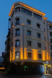 a tall building with lights on the side of it at Felicity Hotel İstanbul in Istanbul