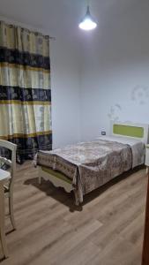 Postel nebo postele na pokoji v ubytování Gio' house