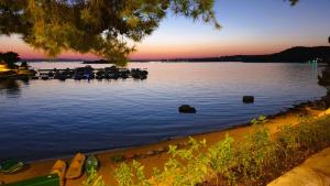 a view of a body of water at sunset at Lucas Mobile Home - premium mobile home with terrace and patio in Drage