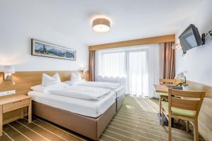 Postel nebo postele na pokoji v ubytování Apart Hotel Garni Wieser