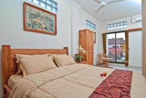庫塔的住宿－庫塔生態酒店，一间卧室,卧室内配有一张大床