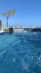 Bazén v ubytování Apartment in Santo Domingo Piantini nebo v jeho okolí