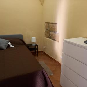 Tempat tidur dalam kamar di Case Vacanze Maltese