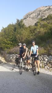 a group of three people on bikes on a road at Les Terrasses du Paradis in Orpierre