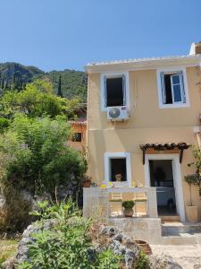 a villa with a view of the house at Corfu sea view house - Live in Corfu like a local! in Ágios Márkos