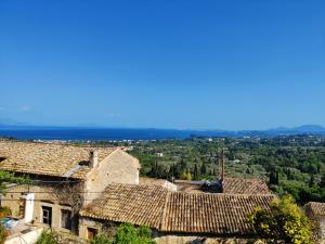 an aerial view of a village with roofs at Corfu sea view house - Live in Corfu like a local! in Ágios Márkos
