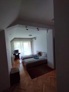 Postel nebo postele na pokoji v ubytování VILA MARKO