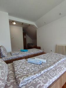 Postel nebo postele na pokoji v ubytování VILA MARKO