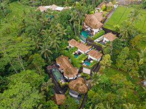 an aerial view of a house in the forest at Keliki Luxury Lodge in Ubud