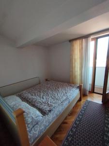 Postel nebo postele na pokoji v ubytování VILA MARKO