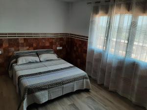 Llit o llits en una habitació de EL ARA DE LOS ORISHAS