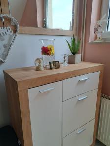a white dresser with a wooden counter top at Kuća za odmor KOD MARE in Vukovar