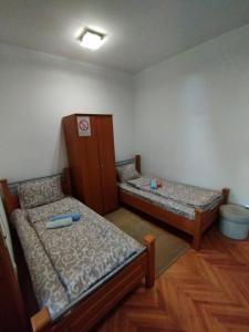 Postel nebo postele na pokoji v ubytování VILA MARKO