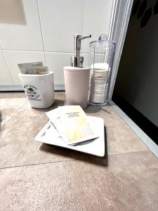 a kitchen counter with a sink and a book on the floor at I Ninni in Castiglione del Lago