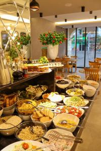 a buffet line with many different types of food at Old Town Point Hotel & Spa Antalya in Antalya