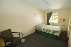 Кровать или кровати в номере Brisbane Manor